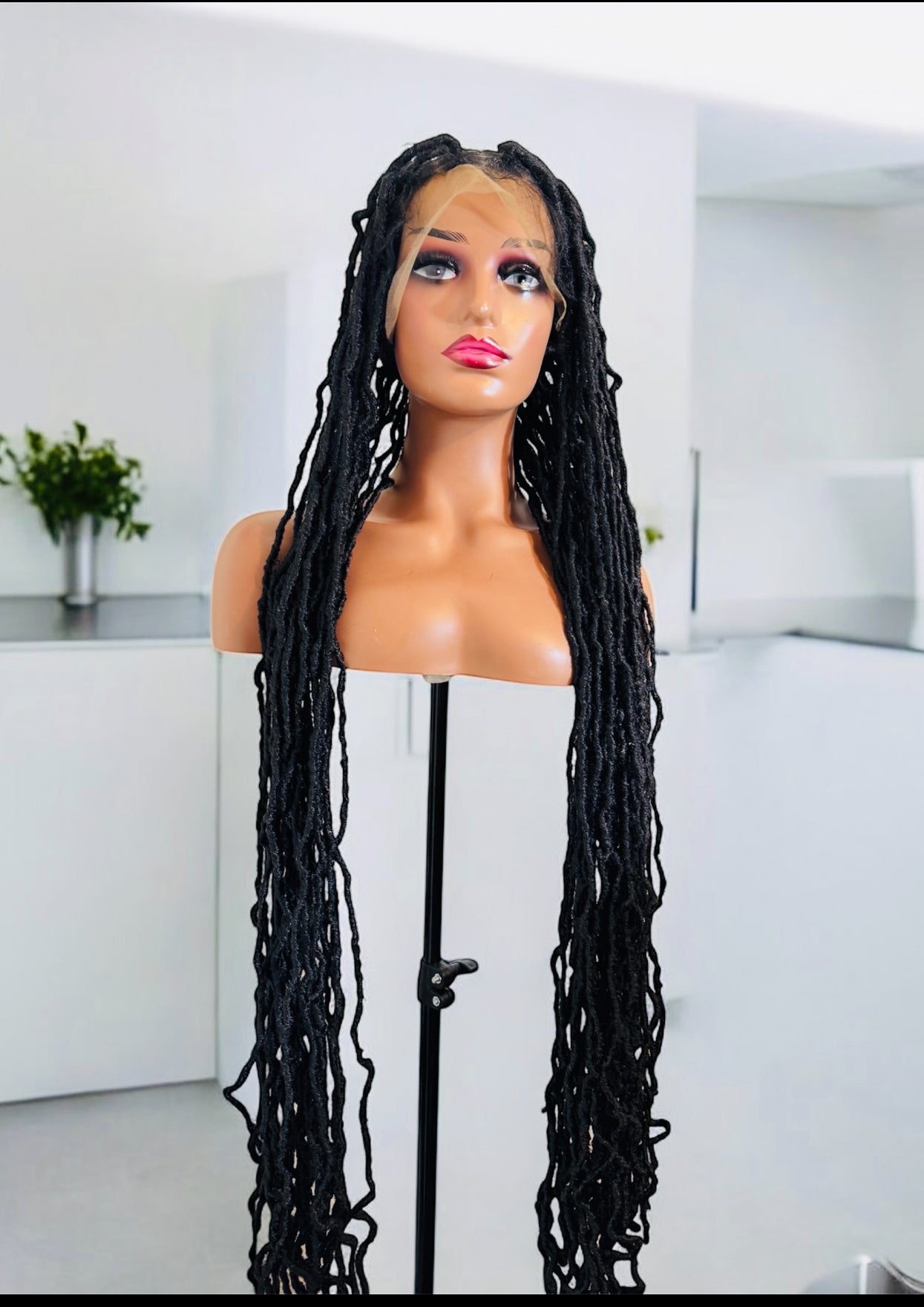 40 inches Faux locs  . Full lace  frontal and knottless African style .