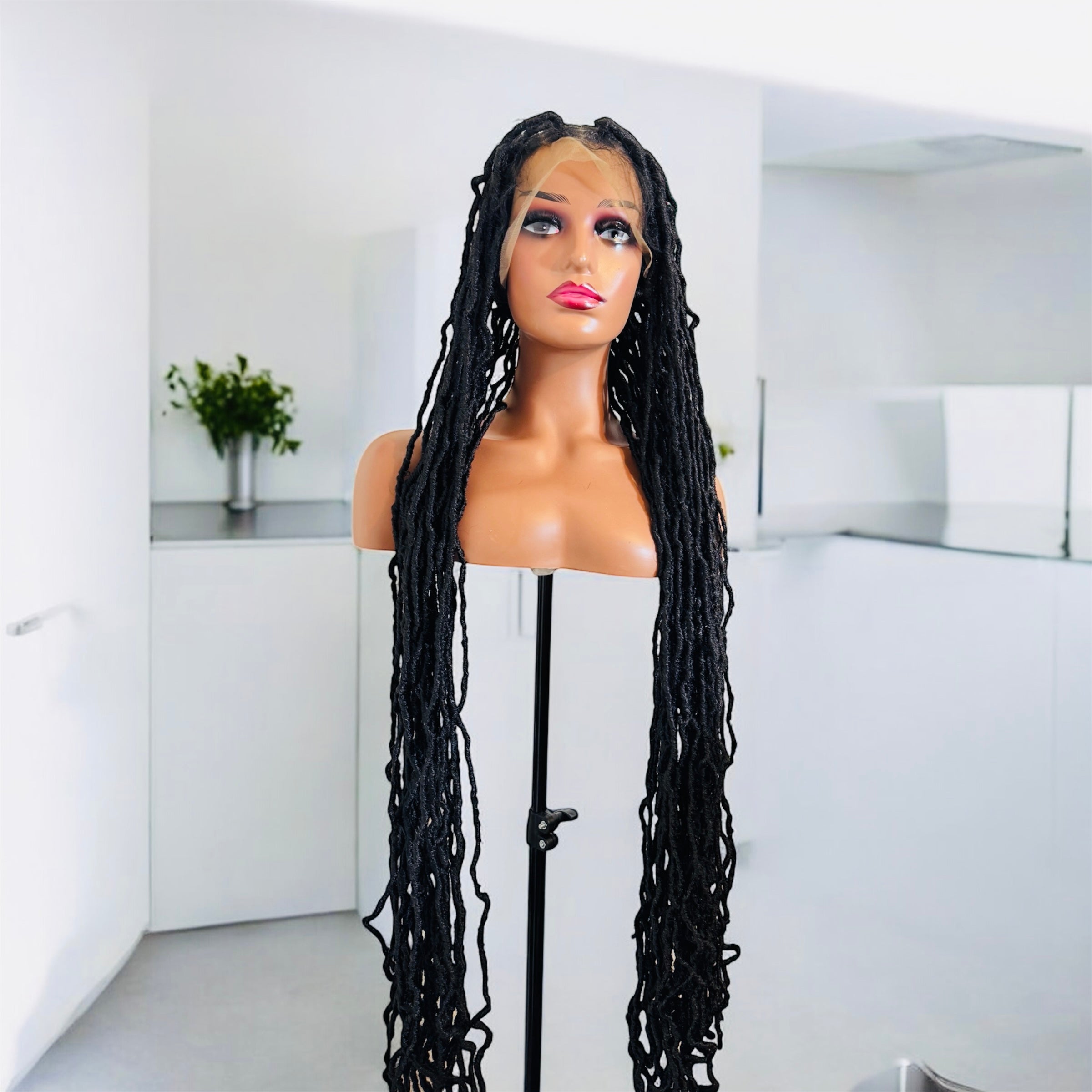 40 inches Faux locs  . Full lace  frontal and knottless African style .